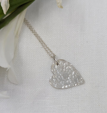 Silver heart shape pendant with hammered texture surface
