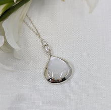 Load image into Gallery viewer, Polished Mother of pearl teardrop set in a silver pendant on a rope chain
