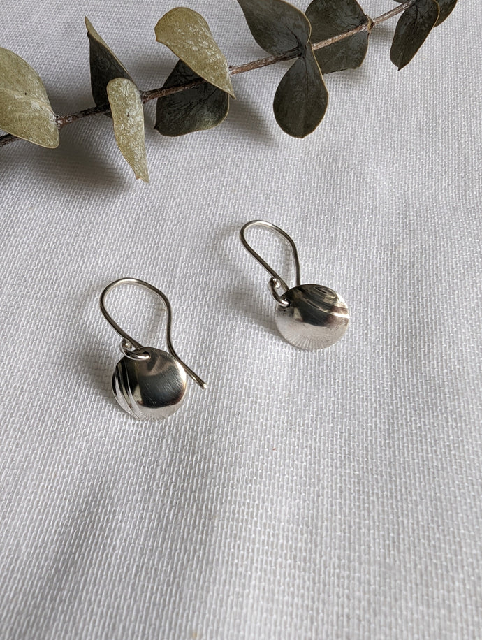 Round silver drop earrings with wavy textured design