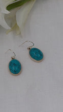 Load and play video in Gallery viewer, Marbled turquoise ovals set in silver dangle and drop earrings
