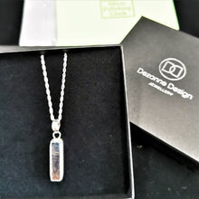 Load image into Gallery viewer, Long rectangular meteorite slice set in a double bezel silver setting as a pendant
