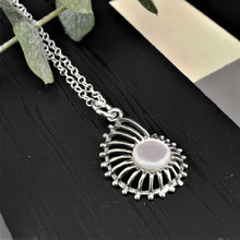 Load image into Gallery viewer, Mother of pearl circle set in a caracol  shape open silver pendant
