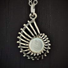 Load image into Gallery viewer, Mother of pearl circle set in a caracol  shape open silver pendant
