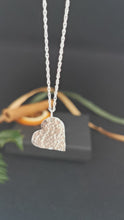 Load and play video in Gallery viewer, Silver heart shape pendant with hammered texture surface
