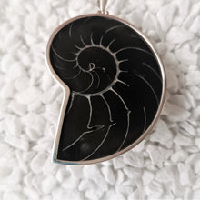 Load image into Gallery viewer, Black nautilus shell pendant with silver surround

