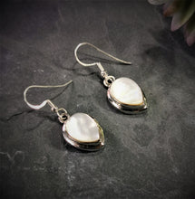 Load image into Gallery viewer, Mother of pearl teardrop dangle and drop earrings set in silver double bezel
