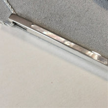 Load image into Gallery viewer, Long silver bar with mother of pearl slice inlaid into the centre
