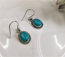 Load image into Gallery viewer, Bright turquoise ovals set in silver ornate dangle and drop earrings

