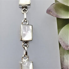 Load image into Gallery viewer, Rectangular white polished moonstones set in a silver chain bracelet
