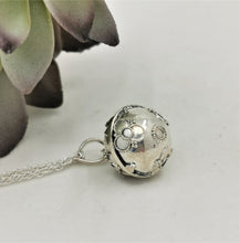 Load image into Gallery viewer, silver sphere with silver flower decoration 
