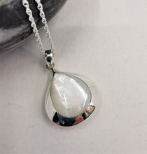 Load image into Gallery viewer, Polished Mother of pearl teardrop set in a silver pendant on a rope chain 
