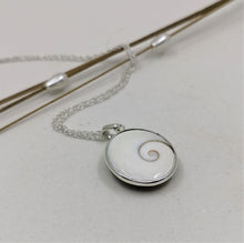 Load image into Gallery viewer, Shiva eye shell round set in silver round pendant
