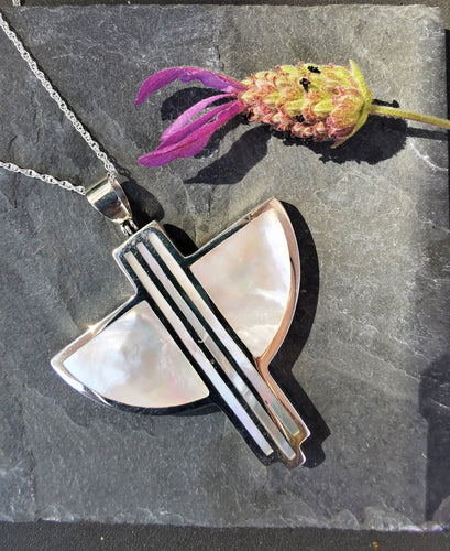 Mother of pearl and silver art deco style silver pendant in semi circular shape